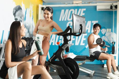 a woman in a bikini on a exercise bike in a gym at Discovery Boracay in Boracay
