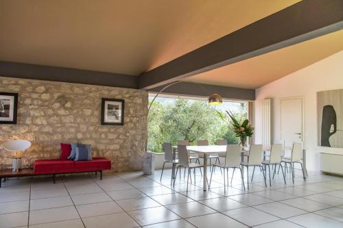 a dining room with a table and chairs at Villa Elena in Manerba del Garda