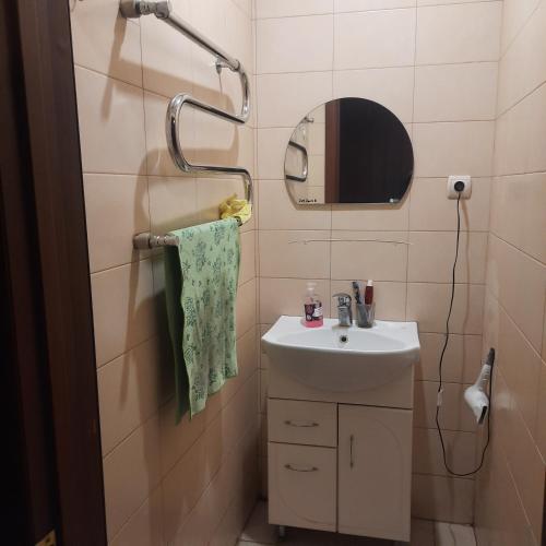 a small bathroom with a sink and a mirror at ГОТЕЛЬ Заводу 410 ЦА in Kyiv