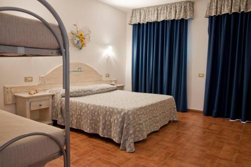 Postel nebo postele na pokoji v ubytování Hotel le Sabbie