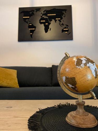 a globe on a table in a living room at Curtigghiu Mondello in Mondello