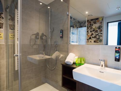 Un baño de Holiday Inn - the niu, Saddle Fürth by IHG