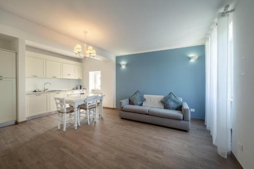 a living room with a couch and a table at Appartamenti Alla Lanterna in Costermano sul Garda