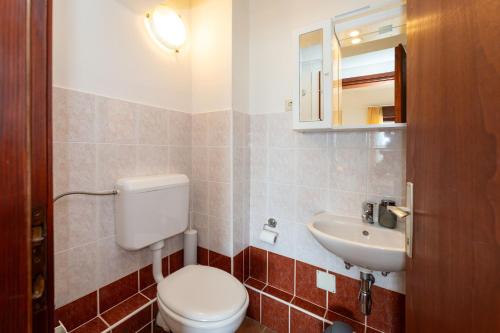 a bathroom with a toilet and a sink at Spacious Apartments by the Sea in Srima, Vodice in Srima