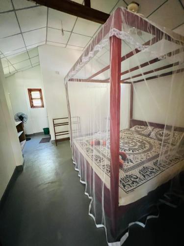 a bedroom with two bunk beds in a room at Vinka Place Arugambay in Arugam Bay