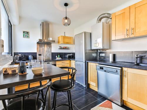 Kuchyňa alebo kuchynka v ubytovaní Appartement cocooning proche centre ville et gare