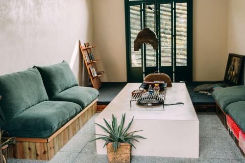 a living room with a couch and a coffee table at YueLore Retreat in Ta-mien-chen