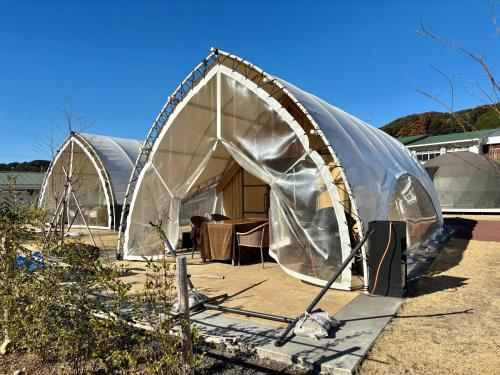 a tent is set up in a yard at Glamping&Port結 in Shimada