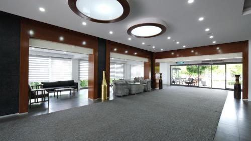 a lobby with a large room with glass doors at The Nix Hotel Kemer in Kemer