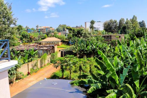 an overhead view of a garden with trees and buildings at Haven Suites Bnb - Runogone in Meru