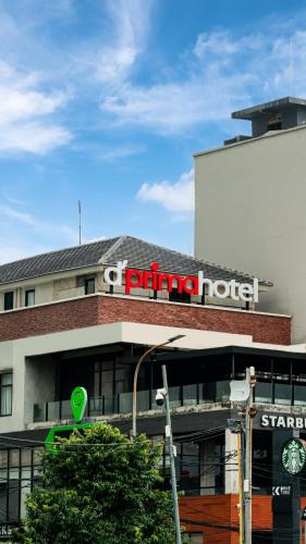 a building with a trump hotel sign on it at d'primahotel Harmoni Jakarta - Hayam Wuruk in Jakarta