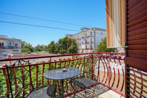 a table and chairs on a balcony with a view at Casa - Merlino in Santo Spirito