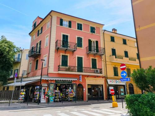 a building on a street in a city at FINARIN Guest House in Finale Ligure