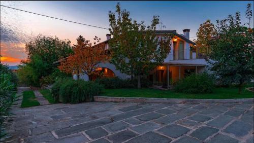 a house with a brick driveway in front of it at Villa La Memma - Private Villa with Pool for 6 in Case Malva