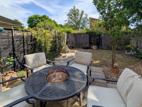 a patio with a table and two chairs at Chilton Charm in Chilton