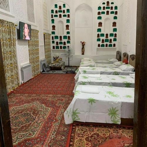 Ένα ή περισσότερα κρεβάτια σε δωμάτιο στο Mekhtar Hostel A National House