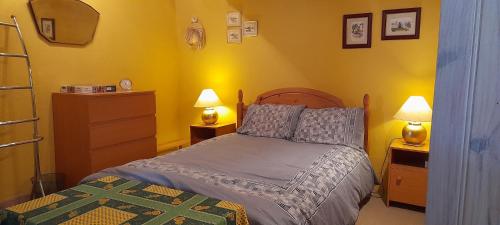 En eller flere senge i et værelse på Sympathique maison de village