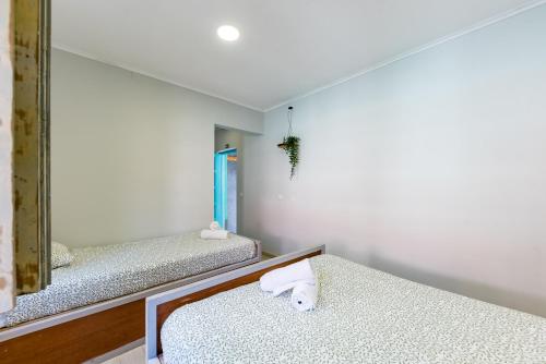 Ένα ή περισσότερα κρεβάτια σε δωμάτιο στο Kali Vice Surf Villa