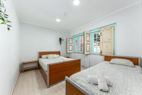 Ένα ή περισσότερα κρεβάτια σε δωμάτιο στο Kali Vice Surf Villa