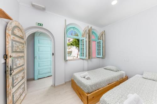 Ένα ή περισσότερα κρεβάτια σε δωμάτιο στο Kali Vice Surf Villa