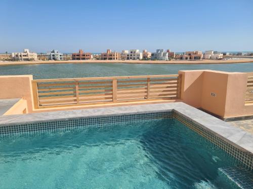a swimming pool on the roof of a building at El Gouna - 3 Bedroom - Rooftop-Pool - Ancient Hill in Hurghada