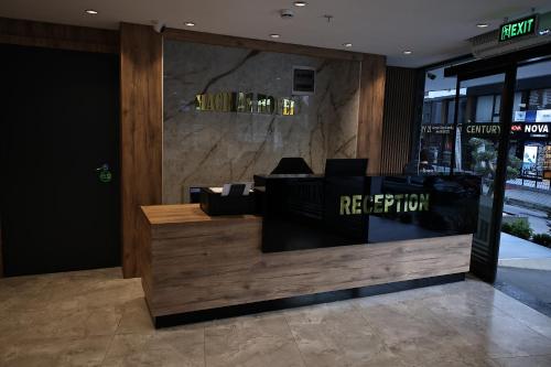 a lobby of a restaurant with a reception desk at Hacıhan Hotel in Trabzon