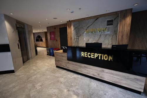 a reception area of a hotel with a reception desk at Hacıhan Hotel in Trabzon