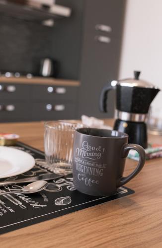 a coffee cup sitting on top of a table at Green Park House in Valeggio sul Mincio