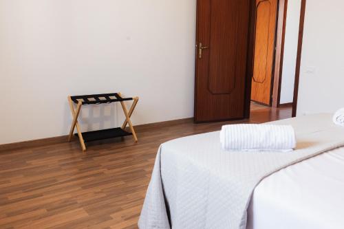 a room with a bed and a wooden floor at Green Park House in Valeggio sul Mincio
