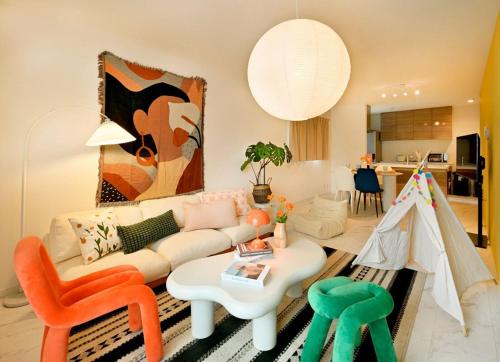 a living room with a couch and a table at Otter Stay - Kogane in Nagoya