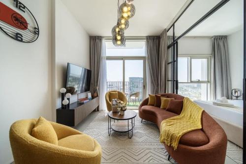 a living room with two chairs and a couch and a tub at Airstay - Sophisticated 2BR - Dubai Hills Estate - Monthly Offer Available in Dubai