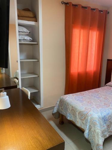 Postel nebo postele na pokoji v ubytování Hostal Retiro