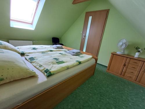 a bedroom with a bed and a window at Jaroslav Ambrož Elvomont Chlum u Třeboně in Chlum u Třeboně