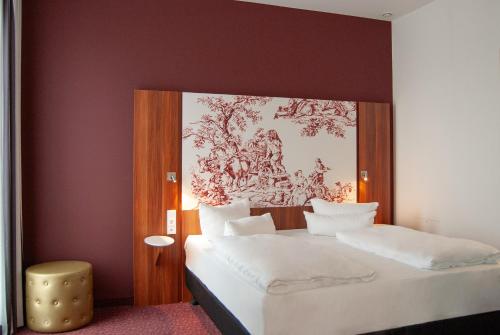Postel nebo postele na pokoji v ubytování IBB Hotel Ingelheim