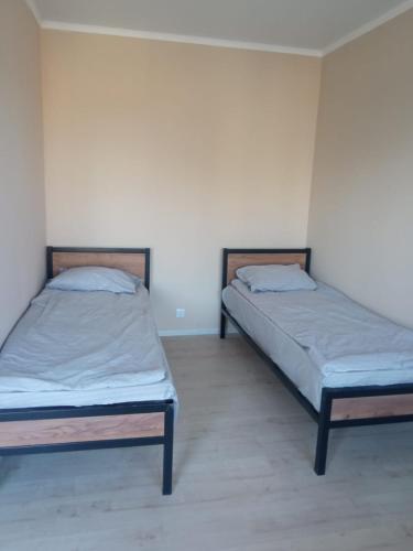 Cama o camas de una habitación en Гостевой дом Нурайым