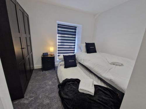 Giường trong phòng chung tại Modern 2 bedroom house near national park