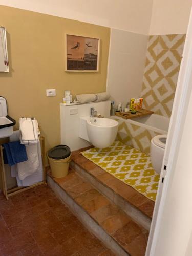 a bathroom with a sink and a toilet at La Meridiana in Vicopisano