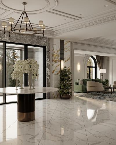 a lobby with a table with flowers on it at Shirvan Grand Hotel Shamakhi in Şamaxı