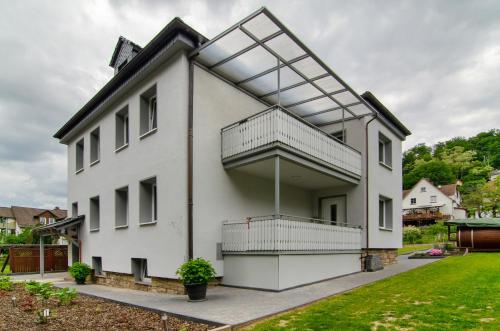 a white house with a lot of windows at Ferienhaus Berger 2025 in Bad Karlshafen