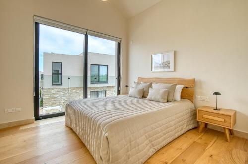 Ένα ή περισσότερα κρεβάτια σε δωμάτιο στο Avalon Gardens Villa 1