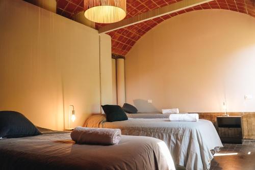 Postel nebo postele na pokoji v ubytování Winehouse in Chacras de Coria