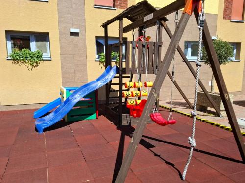 a playground with a slide at Hotel Eminent in Stupava