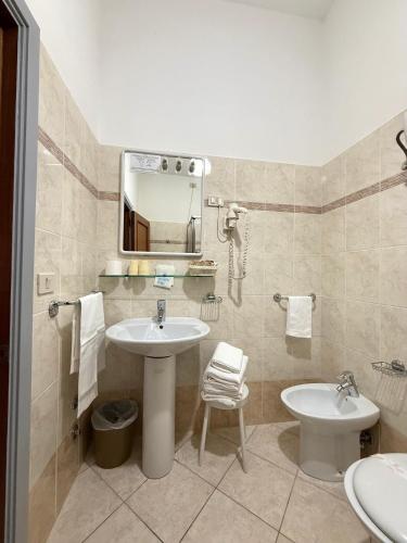 Koupelna v ubytování Grifone Hotel