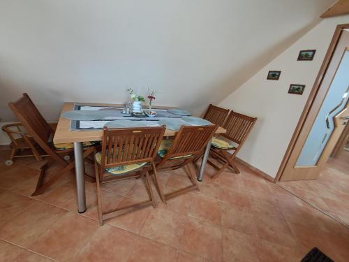 a dining room with a table and chairs at Jaroslav Ambrož Elvomont Chlum u Třeboně in Chlum u Třeboně