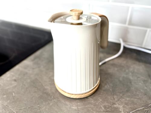 a white kettle sitting on top of a counter at Brand New Lovely Flats by the Forest Tram Stop in Nottingham in Nottingham