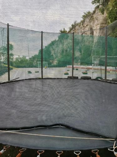a tennis court with a net on a court at Casetta La Grotta in Canicattini Bagni