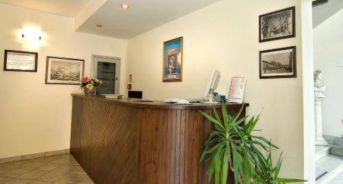 an office with a reception desk in a room at Hotel Marconi in Pietraperzia