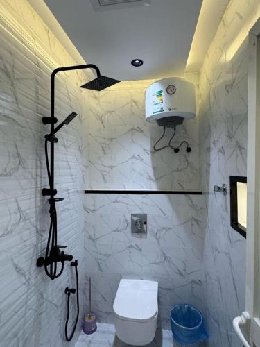 a bathroom with a shower and a toilet in it at شقق فاخرة in Riyadh