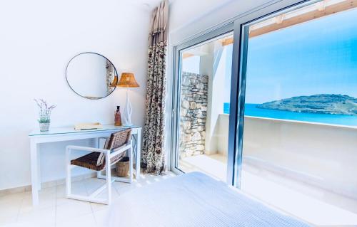 a bedroom with a desk and a mirror at VLK: Villa Lindos Kalliopi, Rhodes in Líndos