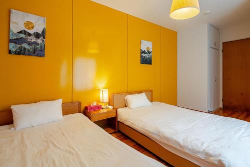 Postel nebo postele na pokoji v ubytování HAKONE Villa Rosso 037h